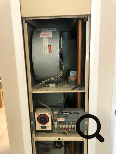 Johnson & Starley J25-32 with front panel removed, showing air circulation fan and time switch