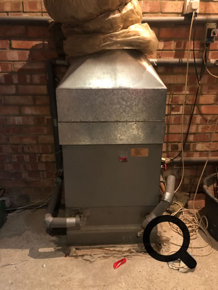 HI-VEE heat interface showing return air duct and water supply pipes.