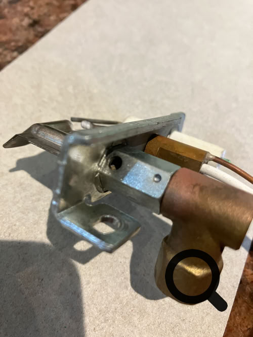 Pilot assembly air hole, now cleared of dust and fluff